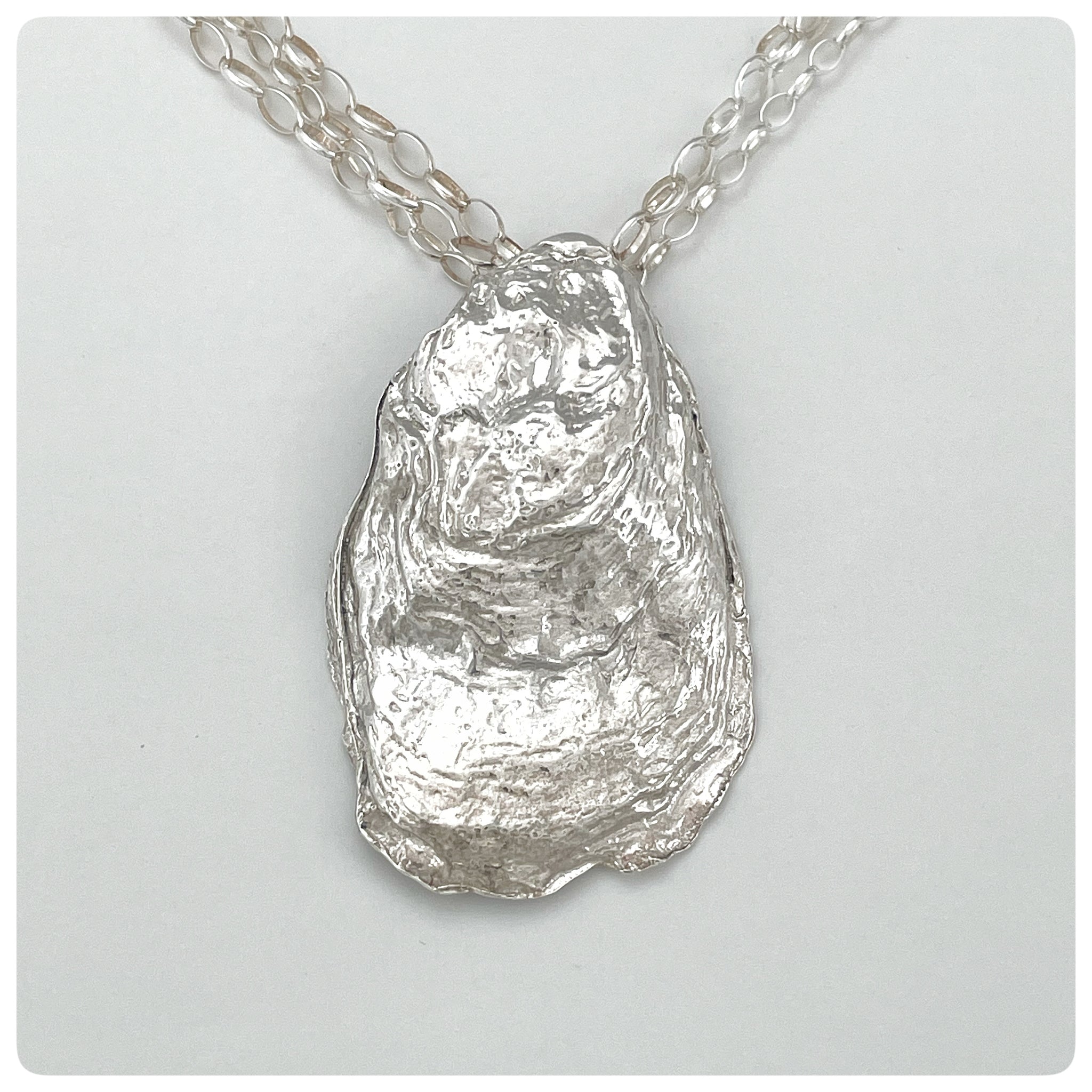 An Unusual Silver Oyster Shell Design Pendant/ Locket With A Cross top Design On A Silver Chain SKU4226